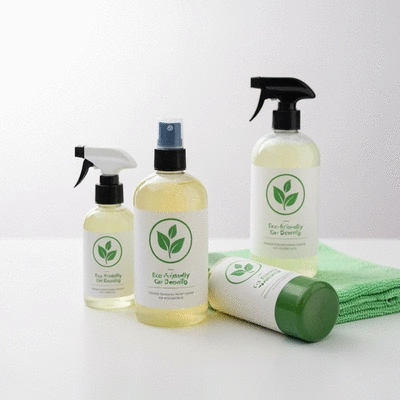 A collection of eco-friendly car detailing products with minimalist green leaf labels on a clean surface.